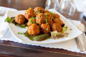 dinner setting with plate of meatballs